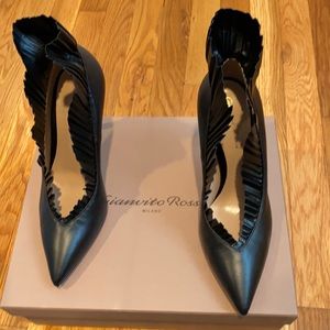 Gianvito Rossi pumps with flair detail.